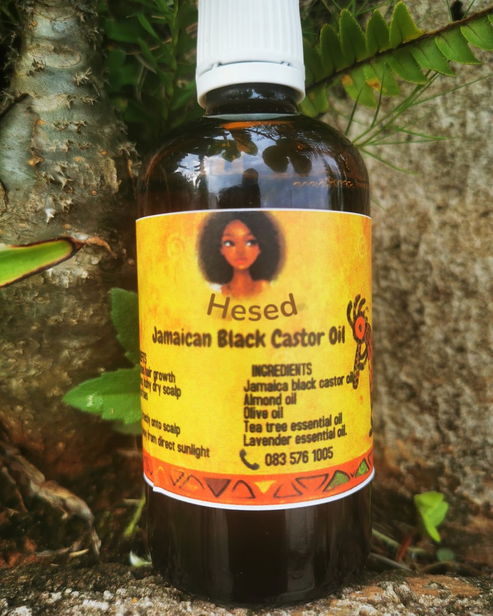 Amber bottle of Jamaican Black Castor Oil with its yellow label